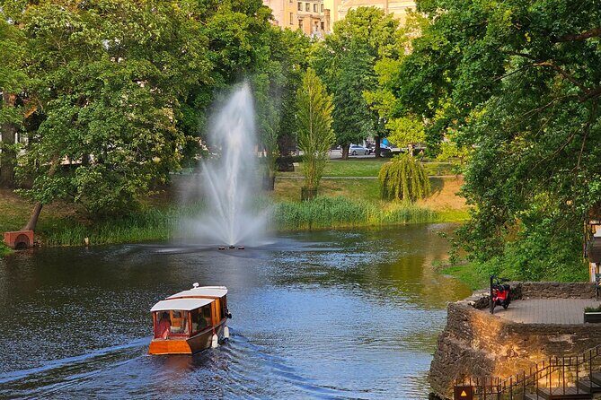 Riga Canal and Daugava Boat Tour with Welcome Drink & Audio Guide - Audio guide through speakers: easy info, no headphone fuss