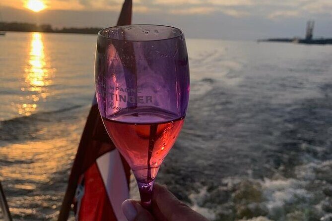 Riga: Evening or Sunset Boat Tour with Drink and Audio Guide - Riga’s Andrejosta cruise: the “short and scenic” format