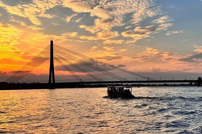 Riga: Evening or Sunset Boat Tour with Drink and Audio Guide - Audio guide through speakers: how to hear the narration clearly