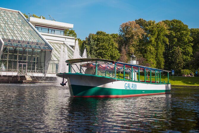 Riga Sightseeing Tour by Canal Boat with Audioguide - Audio guide reality check: smartphone, headphones, and clear listening